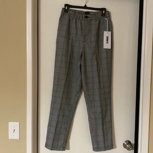 Straight leg flat front chino. black plaid pant